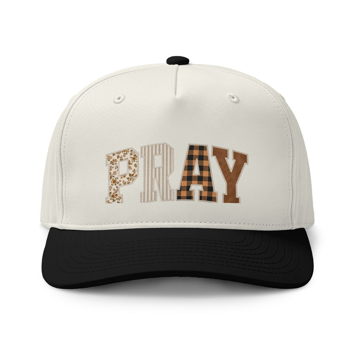 Cream and black two-tone cap featuring “PRAY” in floral, striped, plaid, and solid brown block letters