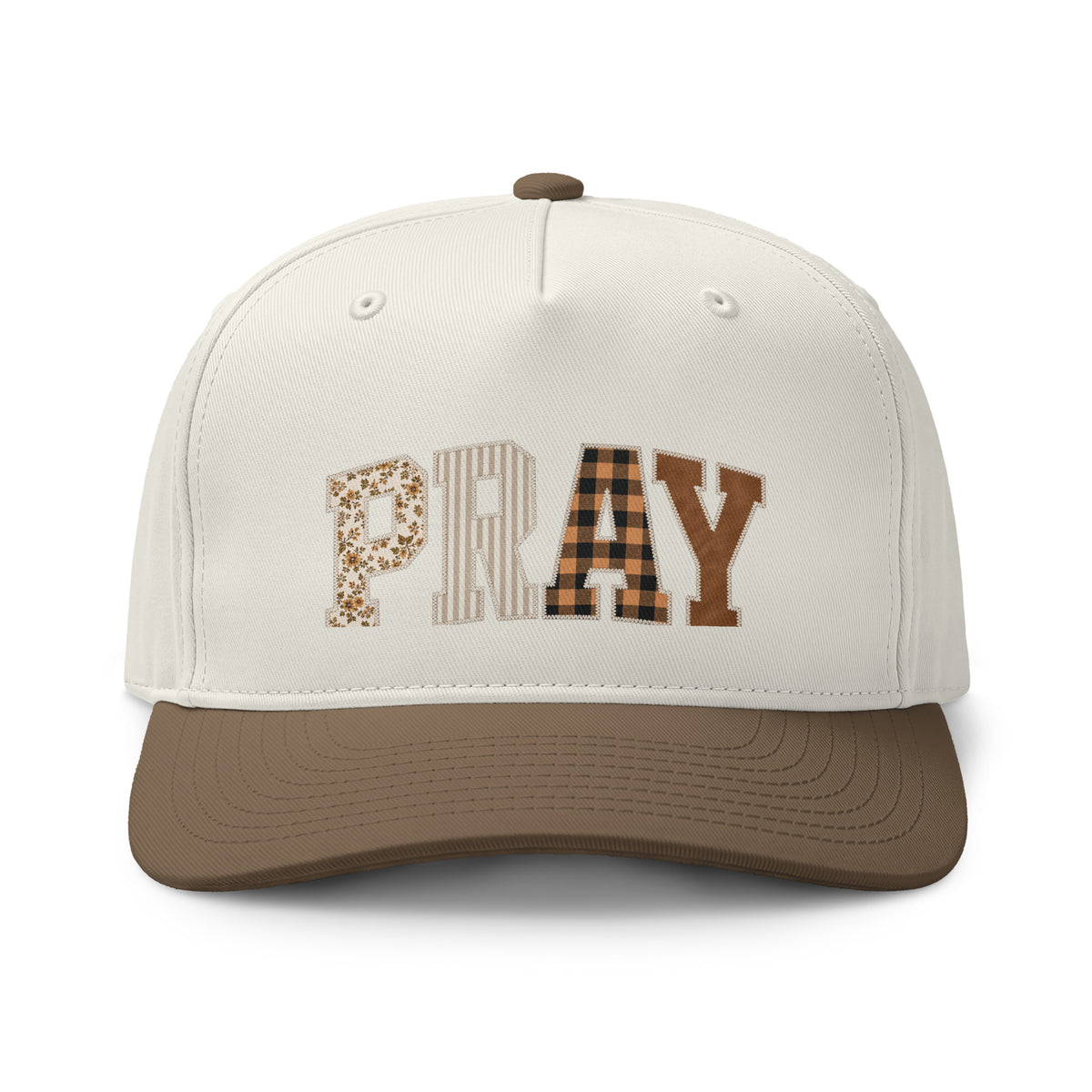 Cream and walnut brown two-tone cap featuring “PRAY” in floral, striped, plaid, and solid brown block letters