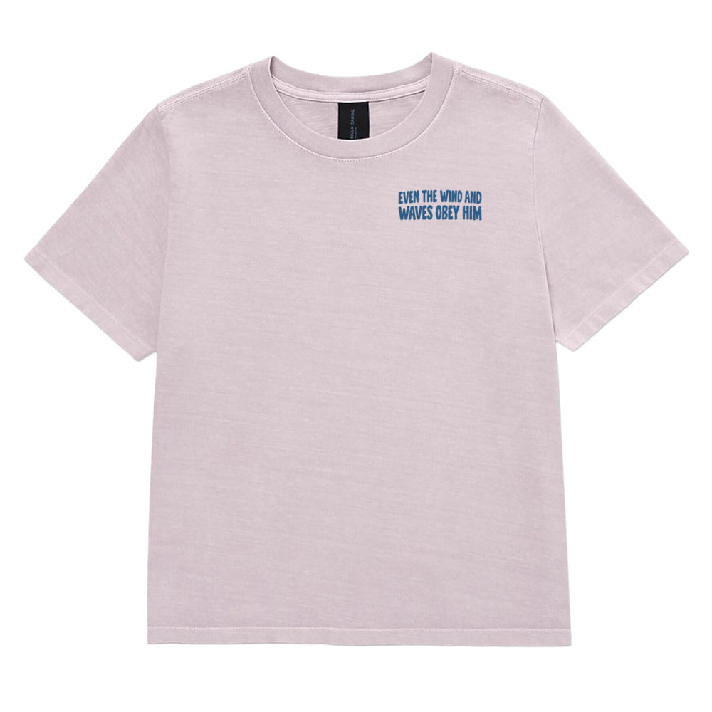 A light purple heathered short-sleeve t-shirt with a small blue text graphic on the left chest reading 'EVEN THE WIND AND WAVES MUST FLOW'. The t-shirt is displayed flat against a solid white background.